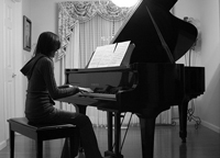 teen girl playing piano