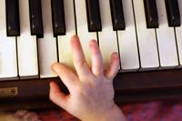 small hand on piano
