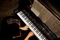 teen girl playing piano