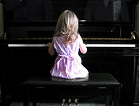 young girl playing piano